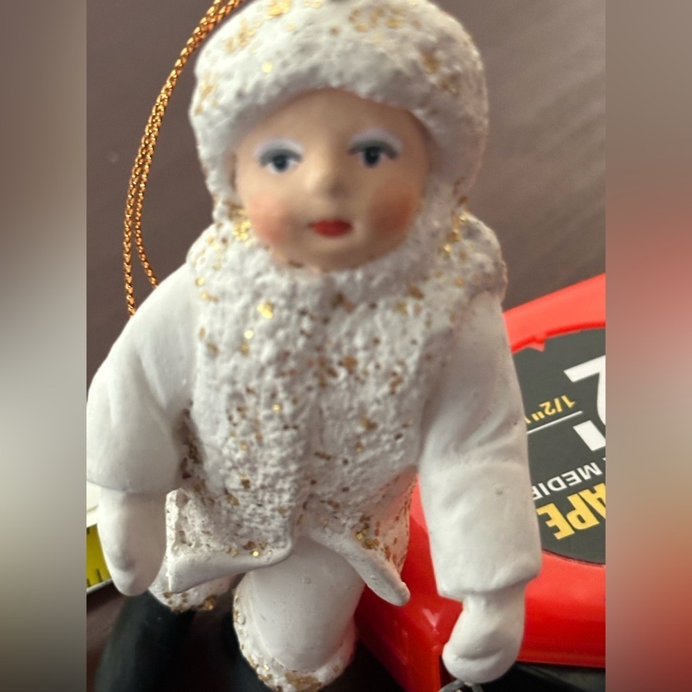 Vintage Department 56 White and Black “Belsnickle” ornament with ringing bell.